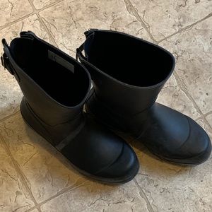 Slip on rain boots.